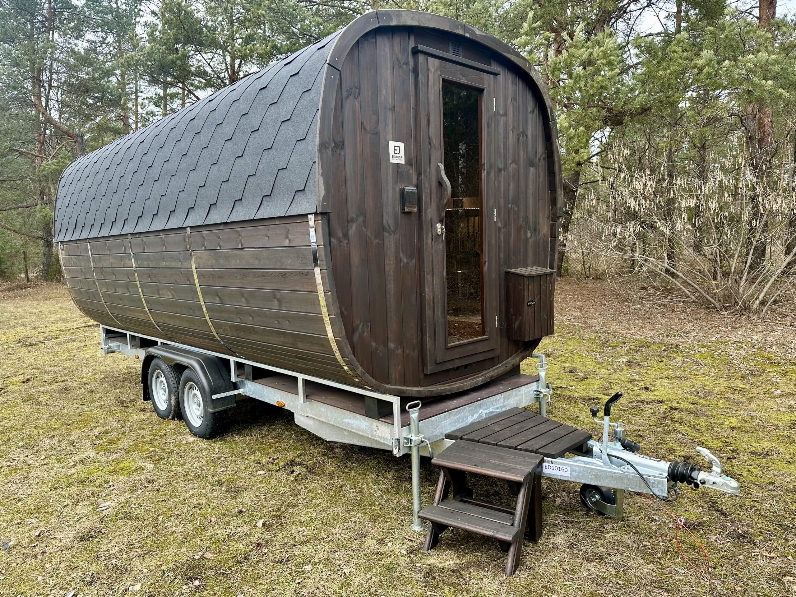 Dark-clad bespoke mobile sauna trailer, brandable as the face of a business
