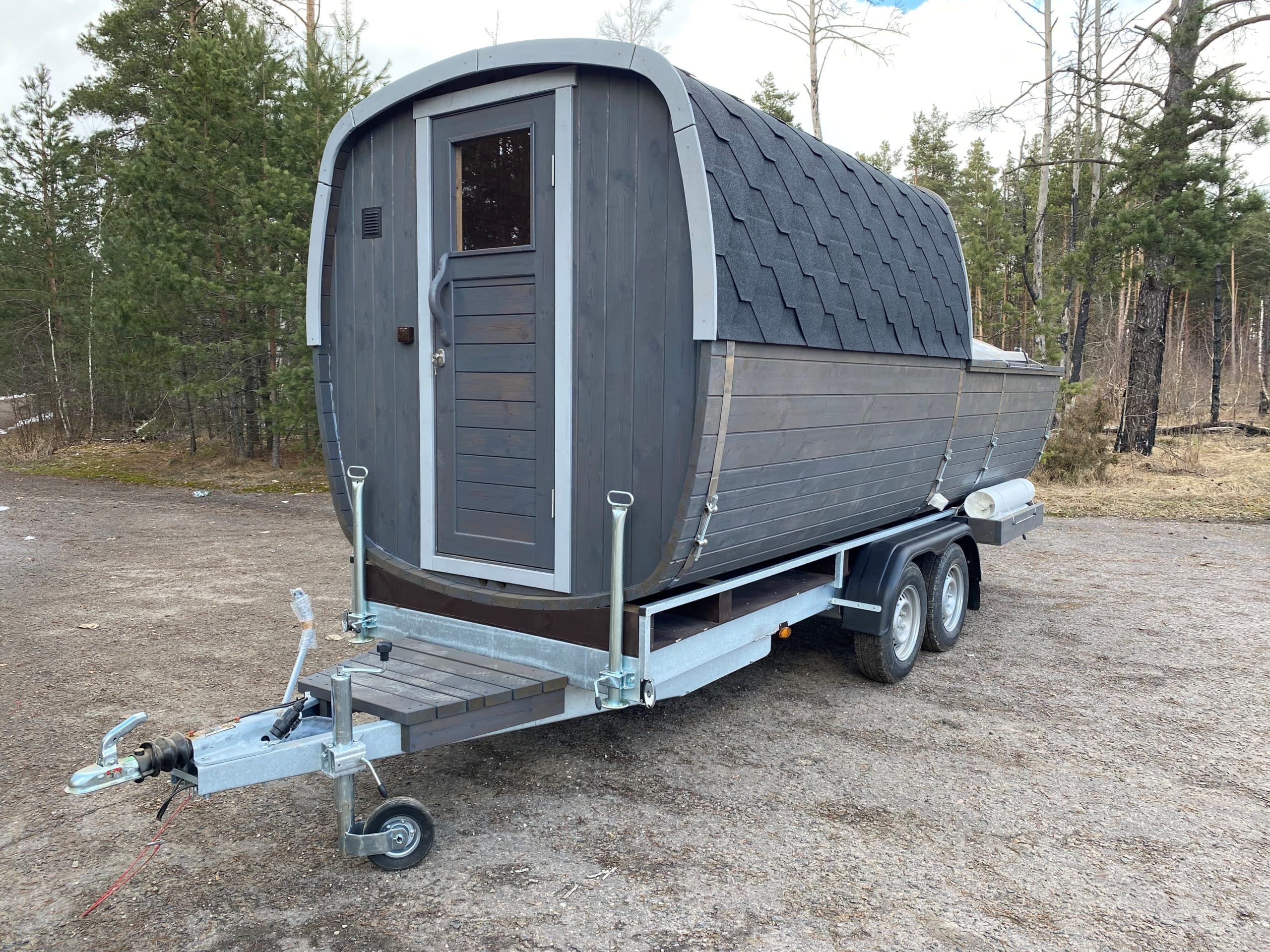 A pod-style mobile sauna trailer that can be towed and moved, unlike a fixed garden sauna